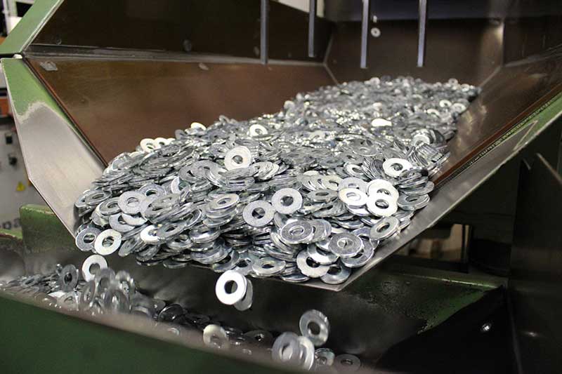 Image of custom washers being sorted.